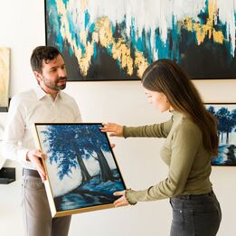 Man showing woman art
